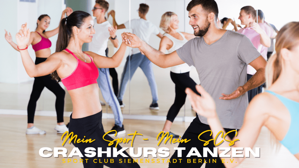 Tanzende Paare im Fitnessstudio, konzentriert und lächelnd, im Hintergrund Spiegel und weitere Teilnehmer.